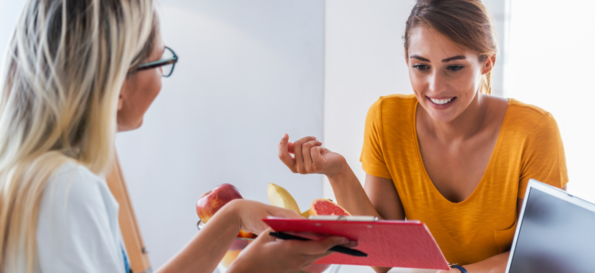 natural health coach discussing wellness goals with a client