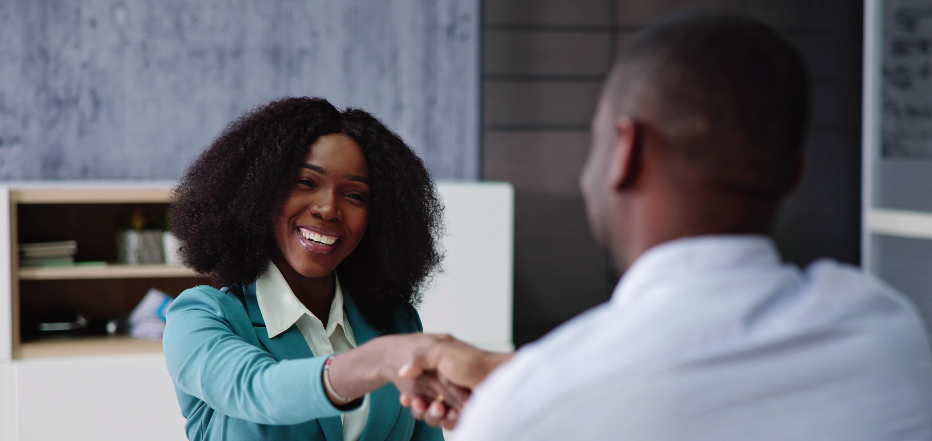 naturopath greeting a client during a wellness consultation