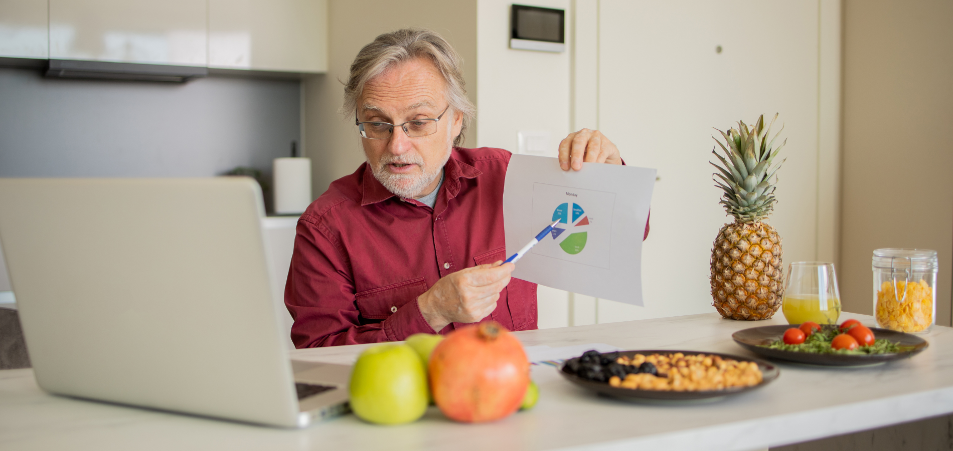 nutritional consultant explaining a food chart during an online wellness session